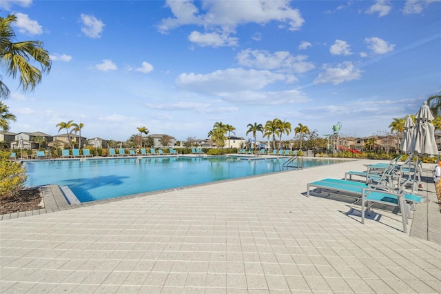 view of swimming pool featuring a patio area