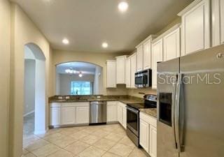 kitchen featuring sink, stainless steel appliances, and white cabinets