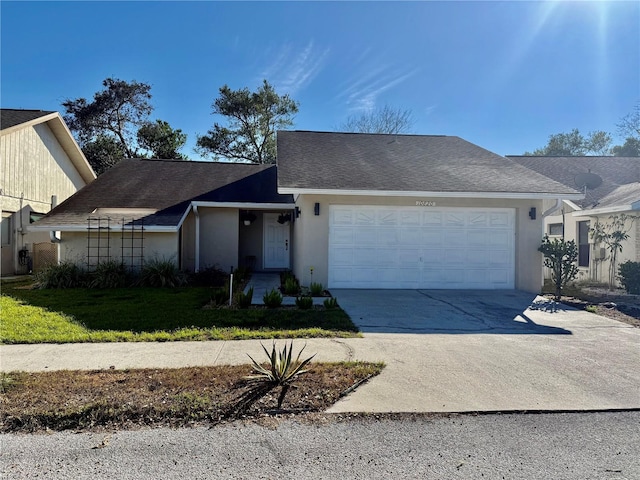 single story home featuring a garage