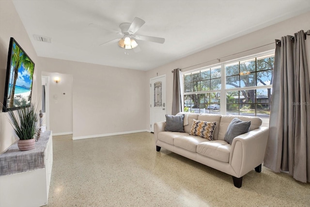 living room featuring ceiling fan