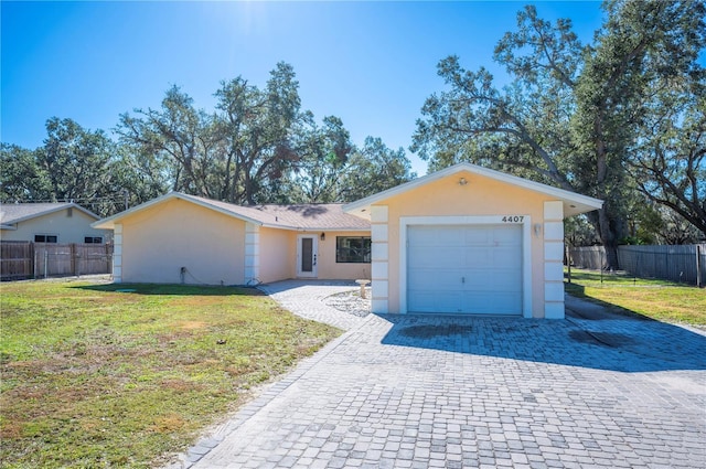 single story home with a garage and a front yard