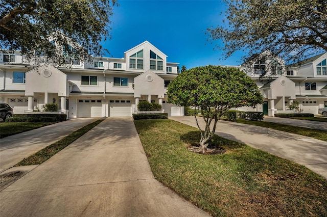 multi unit property featuring a garage