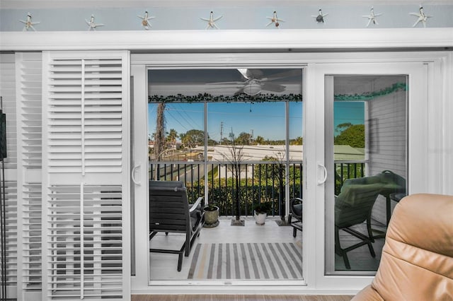 doorway to outside with ceiling fan