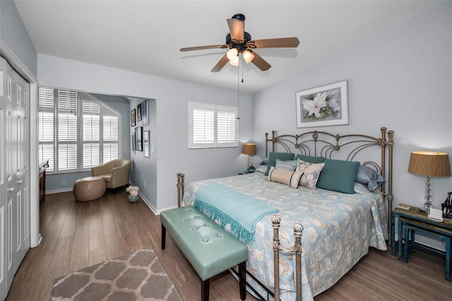 bedroom featuring vaulted ceiling, hardwood / wood-style floors, ceiling fan, and a closet