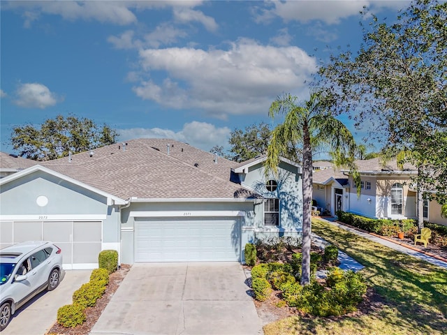 single story home featuring a garage