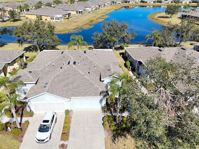 drone / aerial view with a water view