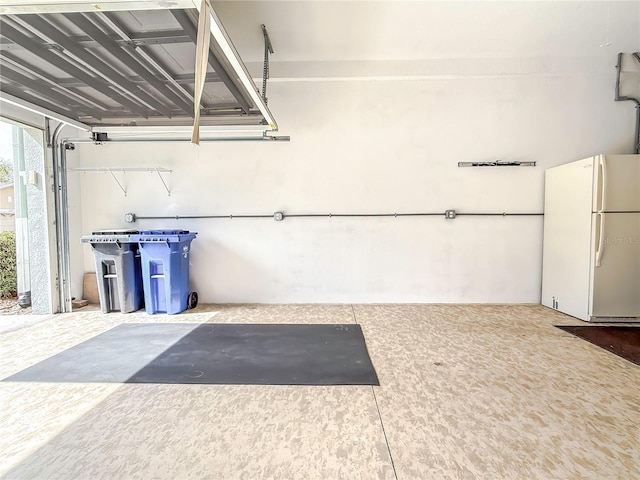 garage with white refrigerator