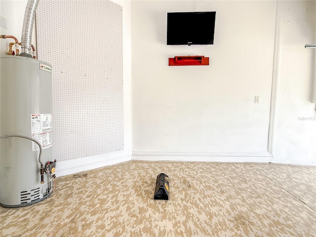 utility room with gas water heater