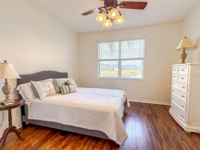 bedroom featuring dark hardwood / wood-style flooring and ceiling fan