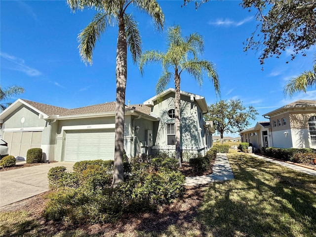 view of front of house featuring a garage and a front yard