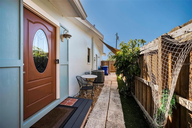 doorway to property featuring cooling unit