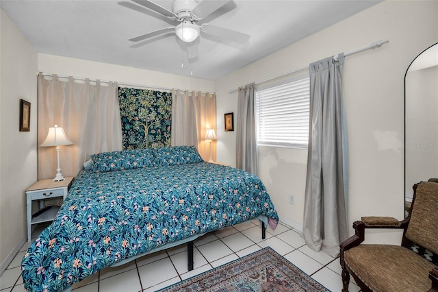 bedroom with ceiling fan and tile patterned floors