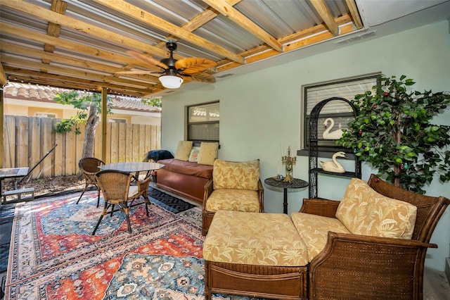 interior space with ceiling fan