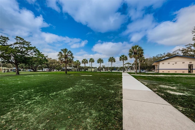 view of home's community featuring a lawn