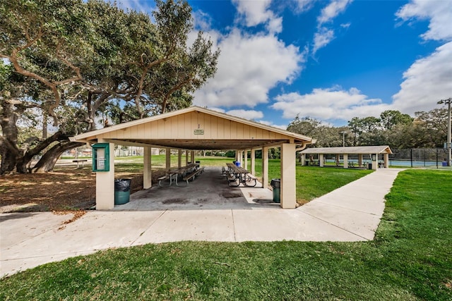 surrounding community with a gazebo and a yard