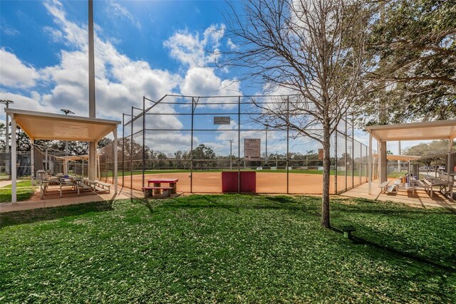 view of jungle gym featuring fence and a lawn