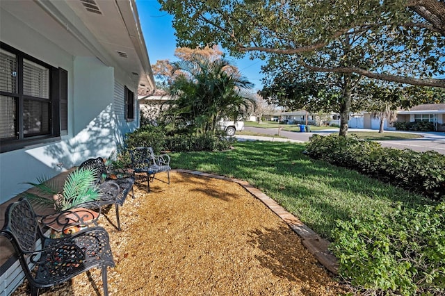 view of yard featuring visible vents