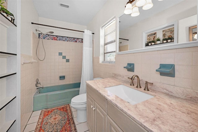 bathroom featuring tile patterned flooring, toilet, visible vents, tile walls, and shower / bath combination with curtain