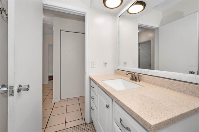 bathroom featuring tile patterned flooring and vanity