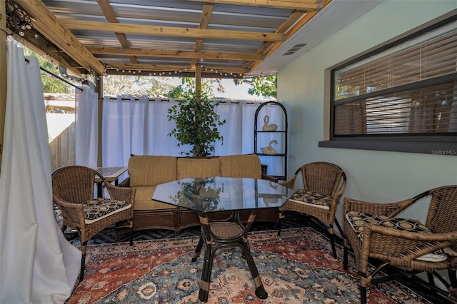 view of patio / terrace featuring fence and visible vents