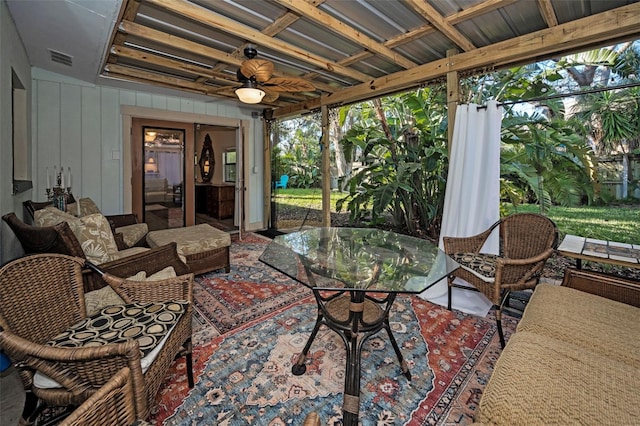 sunroom / solarium with ceiling fan and visible vents