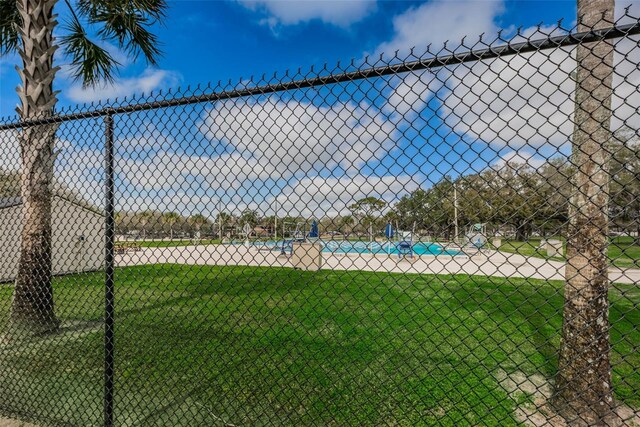 exterior space featuring a yard and fence