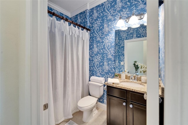 bathroom with crown molding, vanity, and toilet