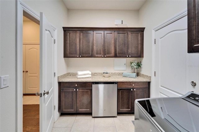 kitchen with electric range oven, dark brown cabinets, and refrigerator