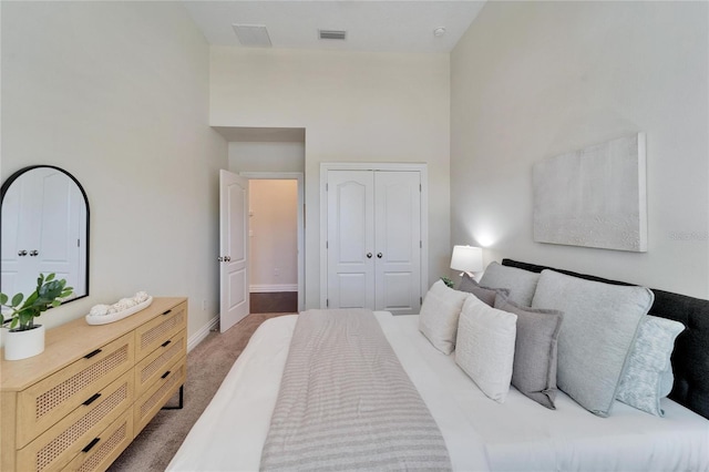 carpeted bedroom featuring a closet