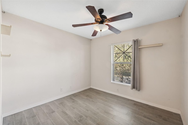 unfurnished room featuring ceiling fan and light wood-type flooring