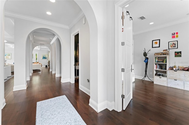 hall featuring arched walkways, dark wood-type flooring, visible vents, and crown molding