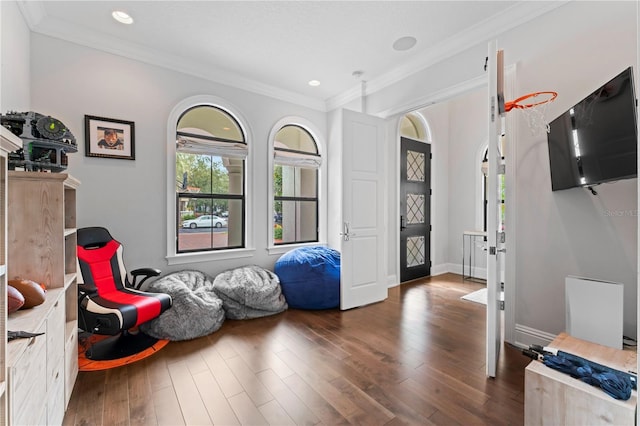 rec room with ornamental molding, recessed lighting, dark wood finished floors, and baseboards