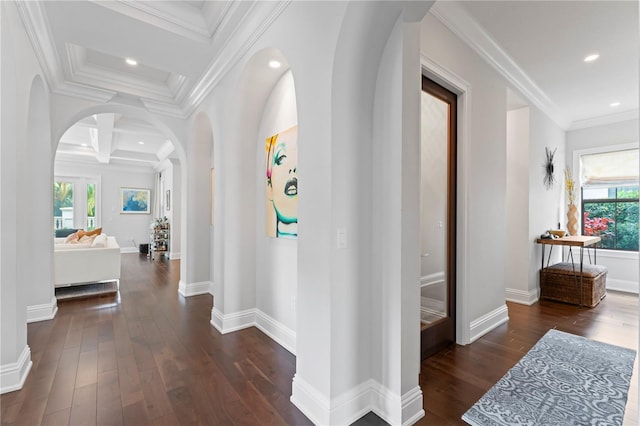 hallway featuring arched walkways, ornamental molding, wood finished floors, and recessed lighting