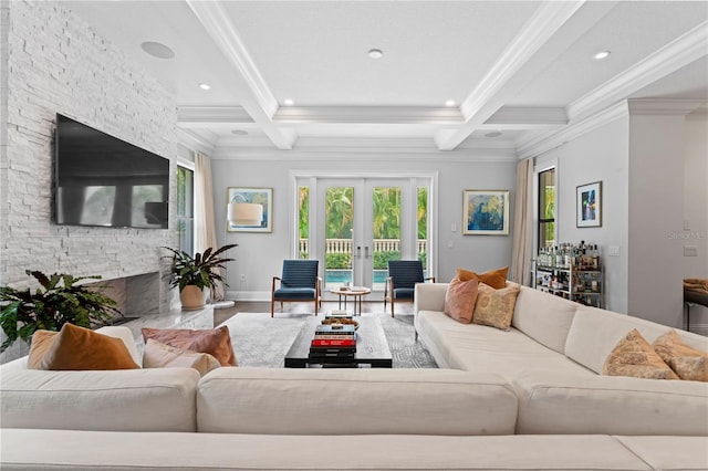 living room featuring french doors, coffered ceiling, and beam ceiling