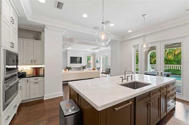 kitchen featuring dark wood-type flooring, oven, french doors, black microwave, and a sink