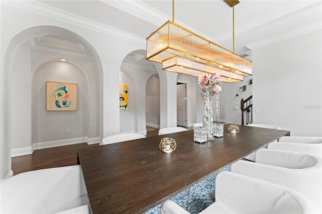 dining space with stairs, ornamental molding, wood finished floors, and baseboards