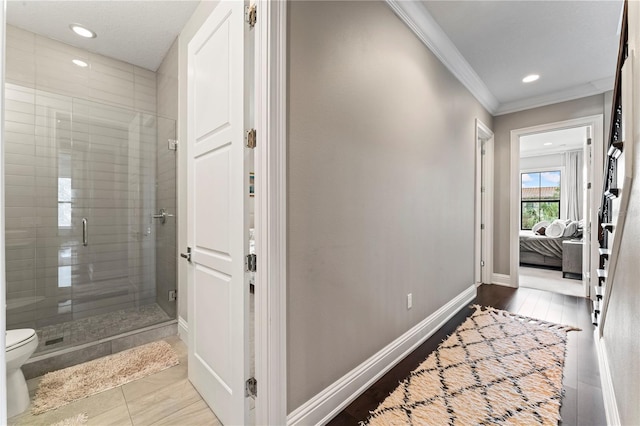 corridor with crown molding, recessed lighting, and baseboards