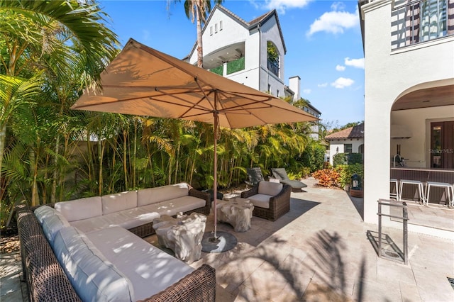 view of patio / terrace featuring a balcony and an outdoor living space