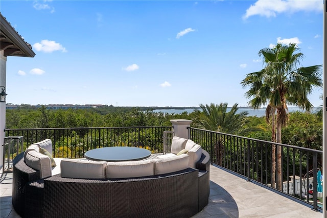 view of patio featuring a balcony and an outdoor hangout area