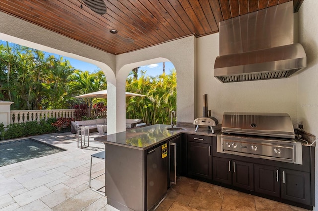 view of patio / terrace featuring a sink, grilling area, an outdoor kitchen, and an outdoor hangout area