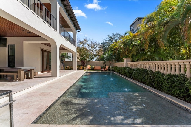 view of pool featuring a patio, fence, and a fenced in pool