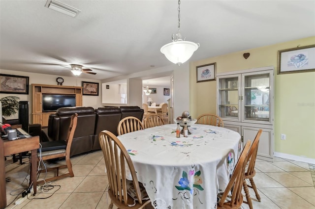 dining room with ceiling fan and light tile patterned floors