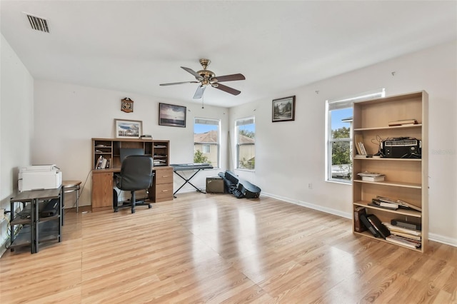 office space with ceiling fan and light hardwood / wood-style flooring