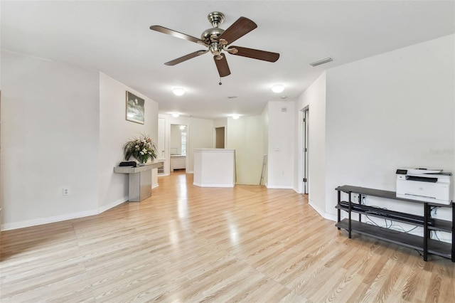 living room with ceiling fan and light wood-type flooring