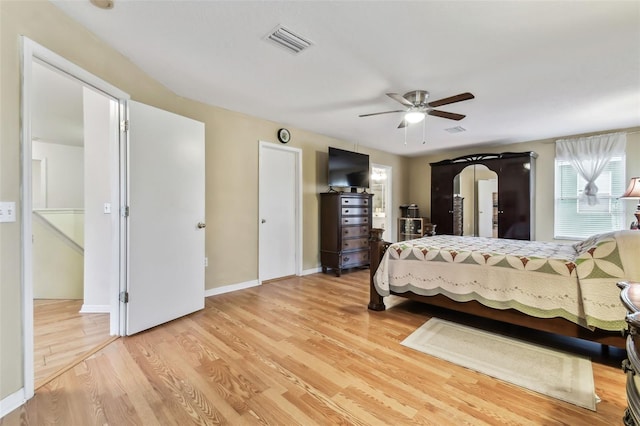 bedroom featuring light hardwood / wood-style flooring and ceiling fan