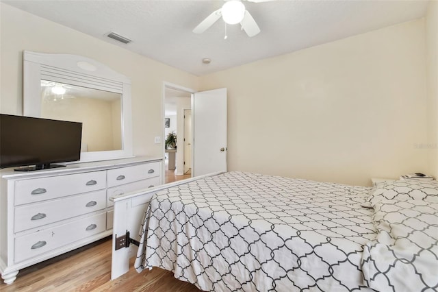 bedroom featuring light hardwood / wood-style flooring and ceiling fan