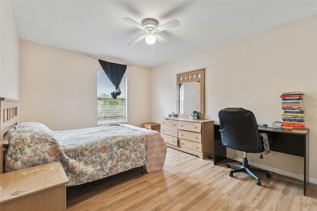 bedroom featuring light wood-type flooring and ceiling fan