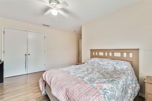 bedroom with a closet, ceiling fan, and light wood-type flooring