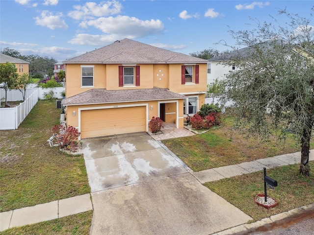 view of front of home featuring a garage and a front lawn