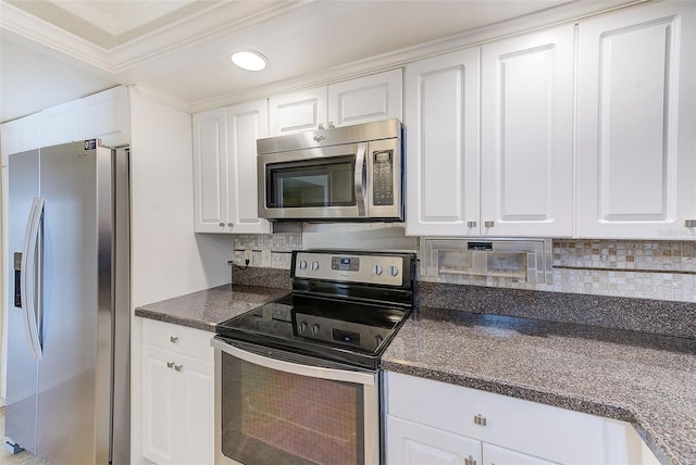 kitchen featuring white cabinetry, backsplash, and appliances with stainless steel finishes